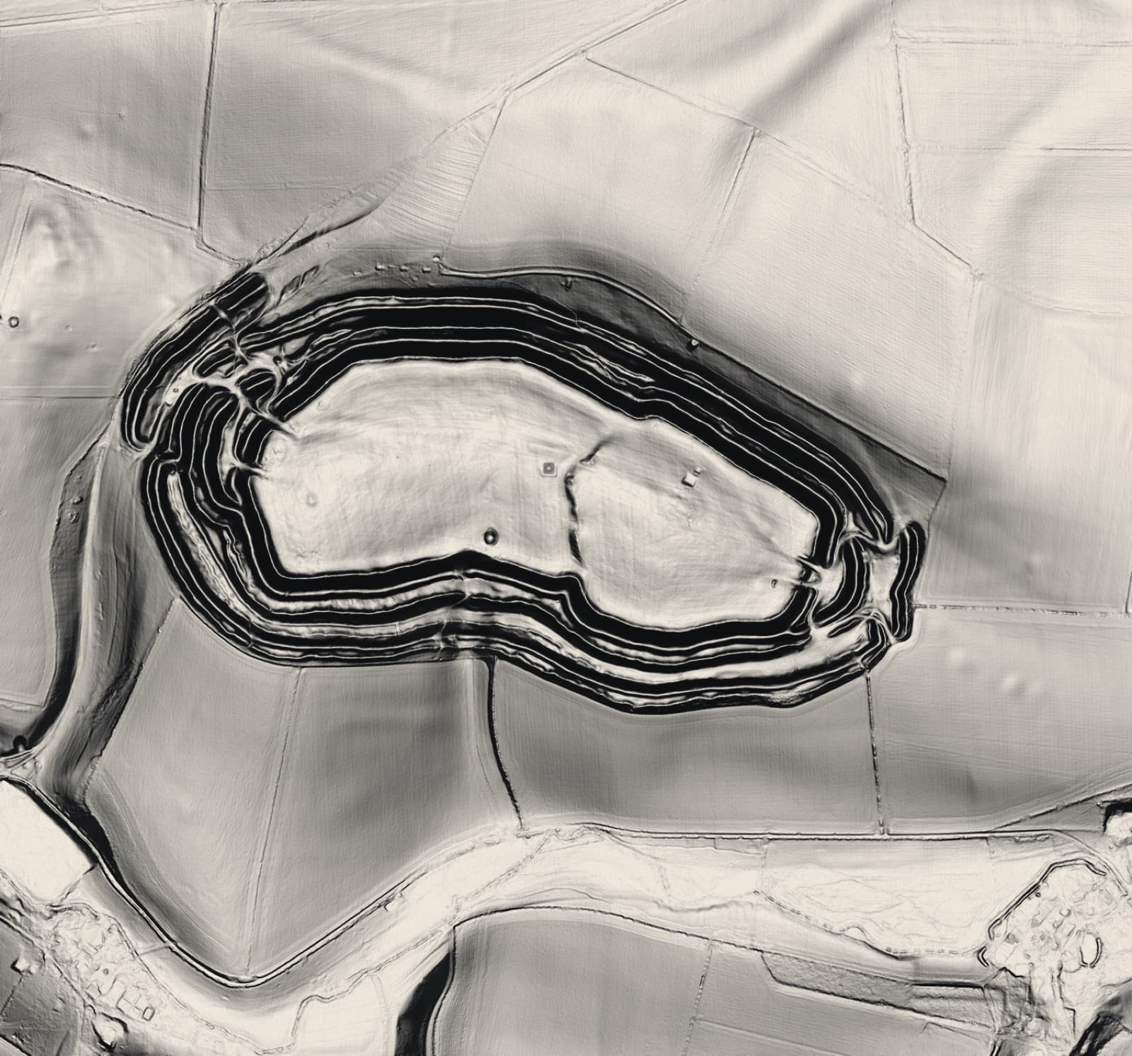 Lidar hillshade of Maiden Castle, Dorset: multiple concentric Iron Age ramparts with a folded eastern entrance, rendered from Environment Agency elevation data